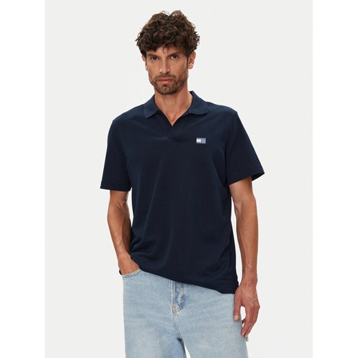 Tommy Jeans Polo Skipper DM0DM21657 Granatowy Regular Fit ze sklepu MODIVO w kategorii T-shirty męskie - zdjęcie 184613243