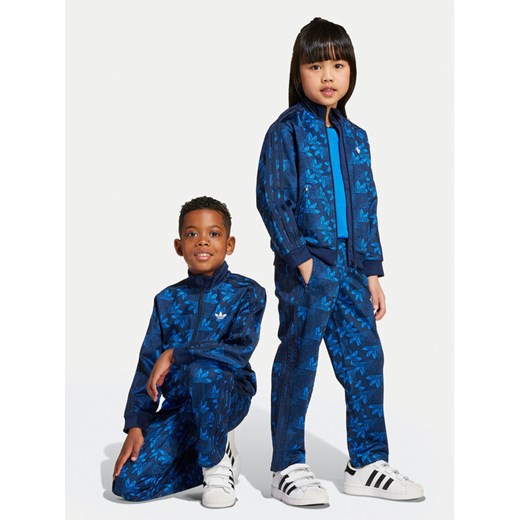 adidas Dres Firebird JW0295 Niebieski Regular Fit ze sklepu MODIVO w kategorii Komplety dziewczęce - zdjęcie 184623630