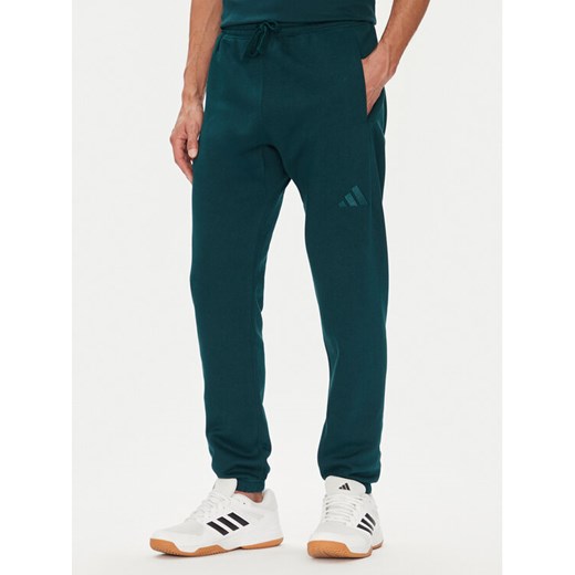 adidas Spodnie dresowe ALL SZN Fleece JX5096 Zielony Tapered Leg ze sklepu MODIVO w kategorii Spodnie męskie - zdjęcie 184632610
