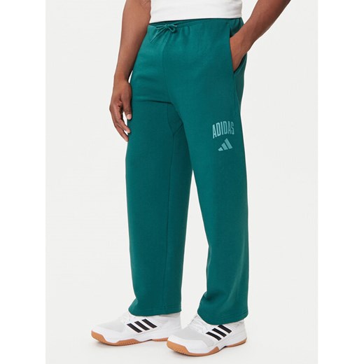 adidas Spodnie dresowe Collegiate JM9178 Zielony Regular Fit ze sklepu MODIVO w kategorii Spodnie męskie - zdjęcie 184661111