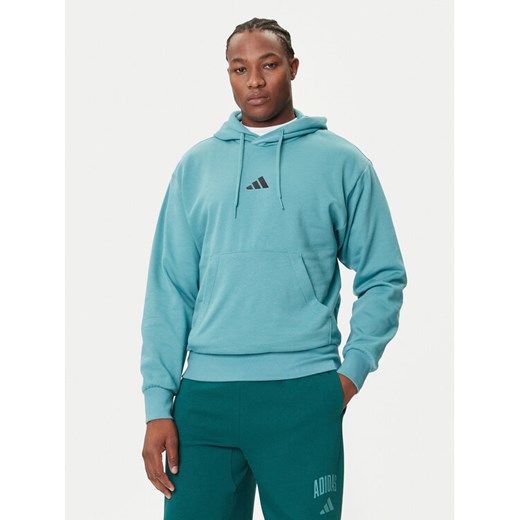 adidas Bluza Essentials Feelcozy JX5659 Turkusowy Regular Fit ze sklepu MODIVO w kategorii Bluzy męskie - zdjęcie 184661112