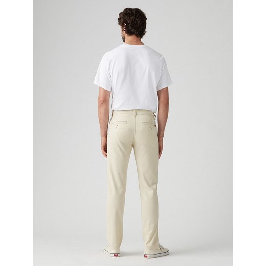 Levi&apos;s Spodnie chino w kolorze beżowym W34/L32 Limango Polska okazja