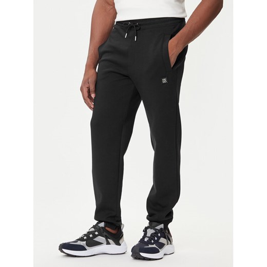 HUGO Spodnie dresowe Dimacs 50533695 Czarny Relaxed Fit ze sklepu MODIVO w kategorii Spodnie męskie - zdjęcie 184688583