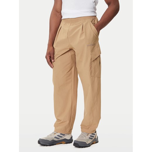 adidas Spodnie outdoor Terrex Xploric JM7424 Beżowy Loose Fit ze sklepu MODIVO w kategorii Spodnie męskie - zdjęcie 184701702