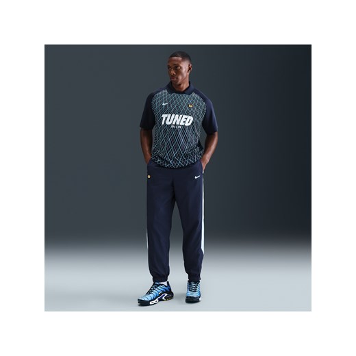 Męskie spodnie z tkaniny Nike Sportswear - Niebieski ze sklepu Nike poland w kategorii Spodnie męskie - zdjęcie 184704211