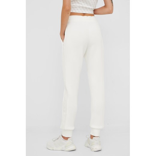 GUESS Beżowe spodnie dresowe damskie Allie Scuba, Rozmiar XS Guess  okazja outfit.pl