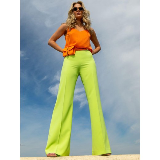 Spodnie damskie limonkowe z rozszerzaną nogawką EyeForFashion ze sklepu Eye For Fashion w kategorii Spodnie damskie - zdjęcie 184746772
