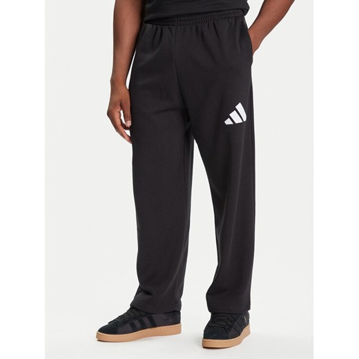 adidas Spodnie dresowe Essentials JF3567 Czarny Loose Fit ze sklepu MODIVO w kategorii Spodnie męskie - zdjęcie 184787730