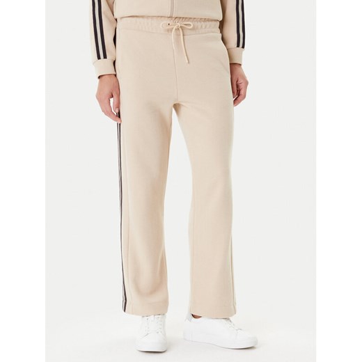 EA7 Emporio Armani Spodnie dresowe 7W000568 AF15528 U1046 Beżowy Relaxed Fit ze sklepu MODIVO w kategorii Spodnie damskie - zdjęcie 184842063