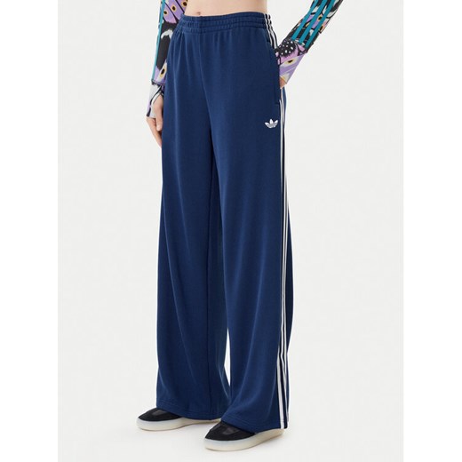 adidas Spodnie dresowe adicolor Firebird JV7524 Granatowy Regular Fit ze sklepu MODIVO w kategorii Spodnie damskie - zdjęcie 184920313