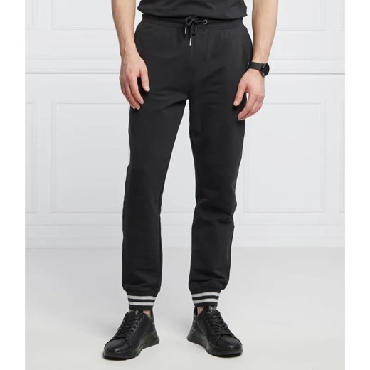 GUESS Spodnie dresowe Adam | Relaxed fit ze sklepu Gomez Fashion Store w kategorii Spodnie męskie - zdjęcie 184948213