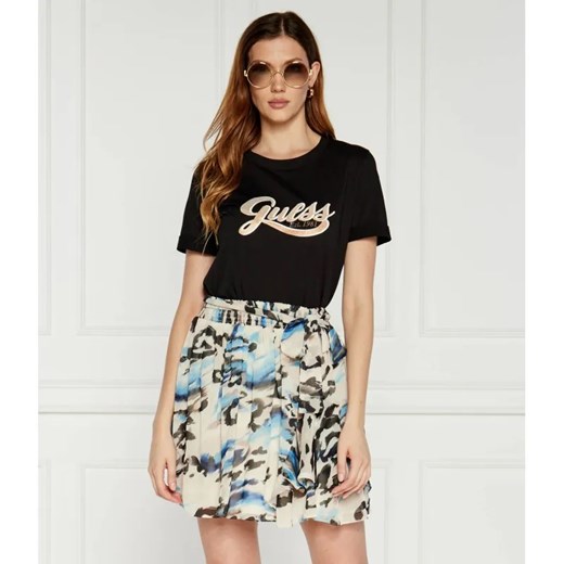 GUESS T-shirt GLITTERY LOGO | Regular Fit ze sklepu Gomez Fashion Store w kategorii Bluzki damskie - zdjęcie 184972322