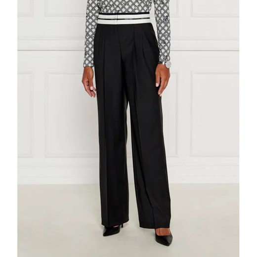 Marc Cain Spodnie chino | flare fit | z dodatkiem wełny ze sklepu Gomez Fashion Store w kategorii Spodnie damskie - zdjęcie 185002851