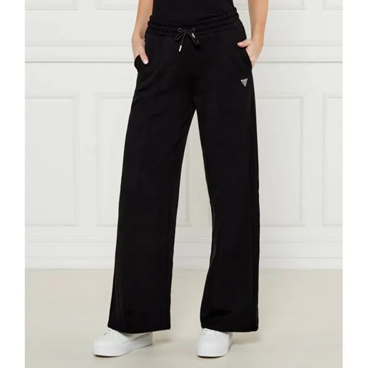 GUESS ACTIVE Spodnie dresowe PRIMULA | flare fit ze sklepu Gomez Fashion Store w kategorii Spodnie damskie - zdjęcie 185005451