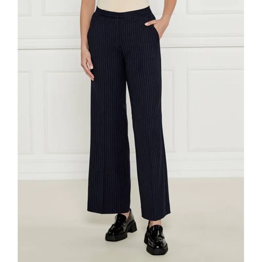 Calvin Klein Spodnie | flare fit | z dodatkiem wełny ze sklepu Gomez Fashion Store w kategorii Spodnie damskie - zdjęcie 185006913