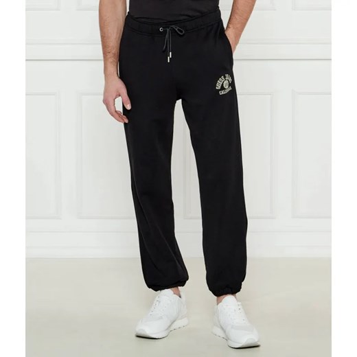 Guess Jeans Spodnie dresowe | Regular Fit ze sklepu Gomez Fashion Store w kategorii Spodnie męskie - zdjęcie 185007321