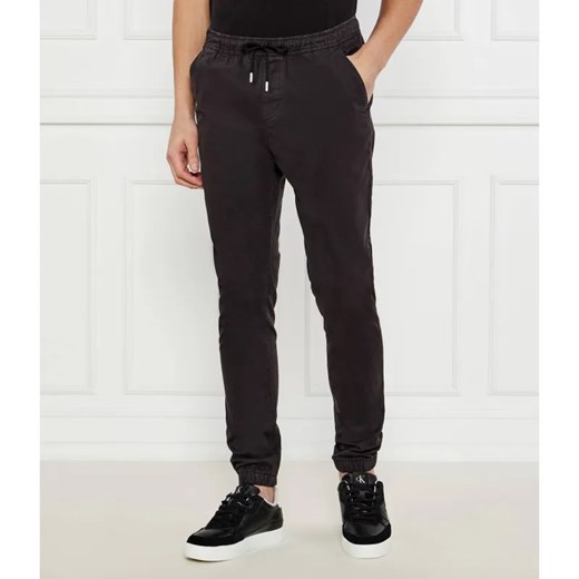 Tommy Jeans Spodnie jogger AUSTIN | Regular Fit ze sklepu Gomez Fashion Store w kategorii Spodnie męskie - zdjęcie 185008070