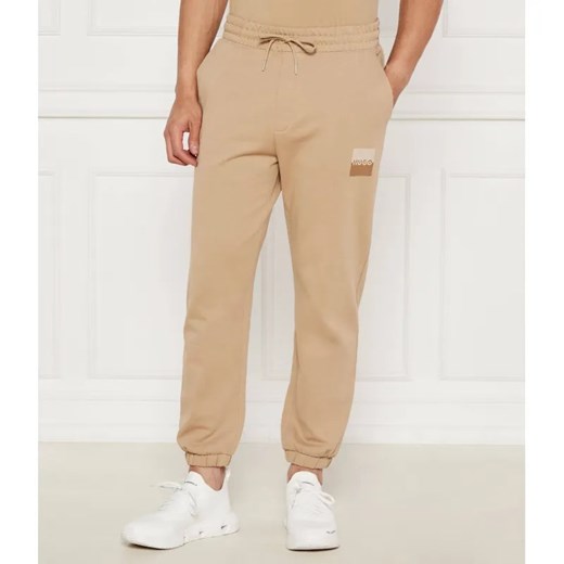 HUGO Spodnie dresowe Dusplitan | Loose fit ze sklepu Gomez Fashion Store w kategorii Spodnie męskie - zdjęcie 185011133