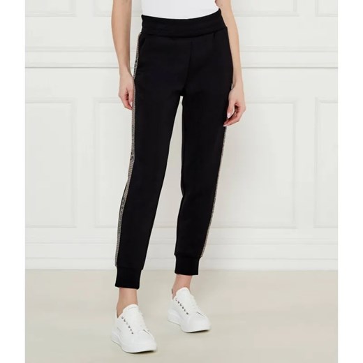 GUESS Spodnie dresowe VICTOIRE | Regular Fit ze sklepu Gomez Fashion Store w kategorii Spodnie damskie - zdjęcie 185012510
