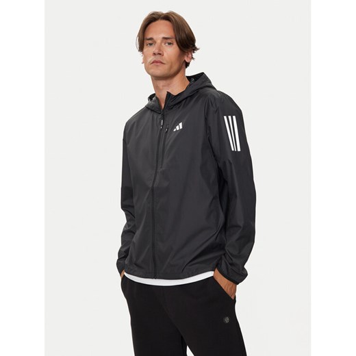 adidas Kurtka do biegania Own The Run IN1483 Czarny Slim Fit ze sklepu MODIVO w kategorii Kurtki męskie - zdjęcie 185030914