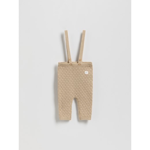 Reserved - Dzianinowe spodnie z szelkami - beżowy ze sklepu Reserved w kategorii Odzież dla niemowląt - zdjęcie 185062324