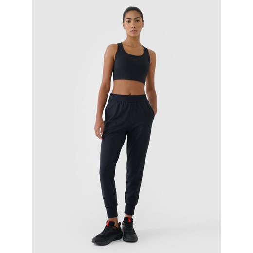 Damskie spodnie treningowe 4F 4FWMM00TFTRF1066 - czarne ze sklepu Sportstylestory.com w kategorii Spodnie damskie - zdjęcie 185066034
