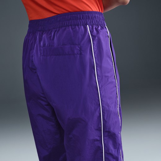 Damskie spodnie z tkaniny z wysokim stanem i luźnymi nogawkami Nike Windrunner - Nike S (EU 36-38) Nike poland