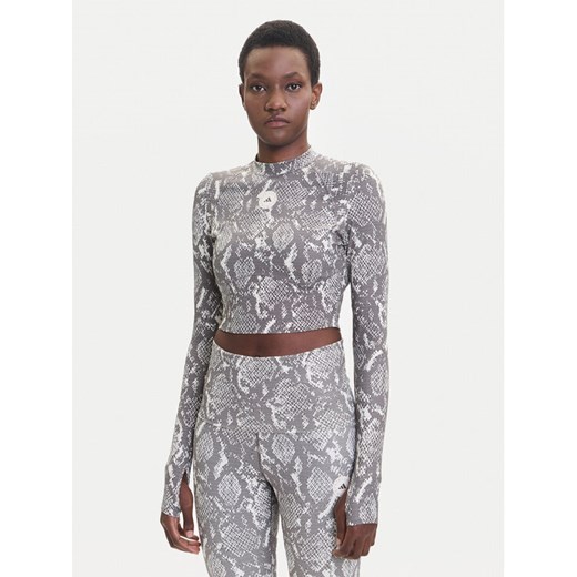 adidas by Stella McCartney Koszulka techniczna Training JM8478 Beżowy Slim Fit ze sklepu MODIVO w kategorii Bluzki damskie - zdjęcie 185371751