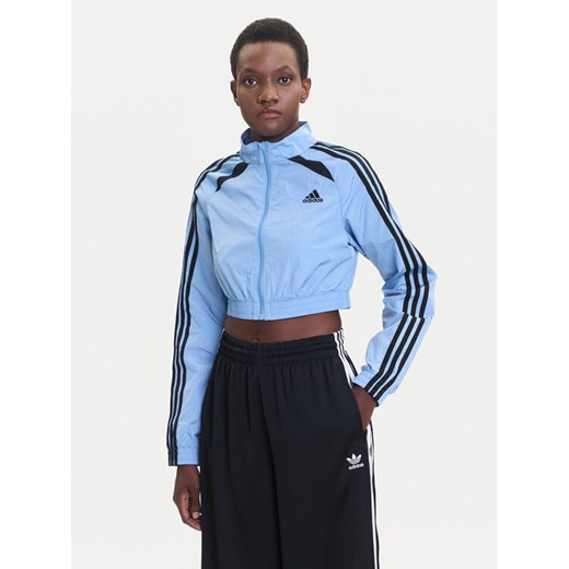 adidas Bluza Teamgeist adicolor JZ8277 Błękitny Slim Fit ze sklepu MODIVO w kategorii Bluzy damskie - zdjęcie 185371761
