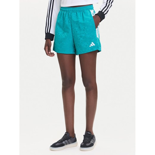 adidas Szorty sportowe Tiro x Common Goal JL9208 Turkusowy Loose Fit ze sklepu MODIVO w kategorii Szorty - zdjęcie 185371770