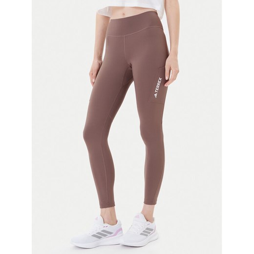 adidas Legginsy Terrex Multi JM0422 Brązowy Slim Fit ze sklepu MODIVO w kategorii Spodnie damskie - zdjęcie 185391261