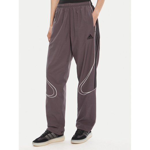 adidas Spodnie dresowe Teamgeist adicolor JW5870 Szary Loose Fit ze sklepu MODIVO w kategorii Spodnie męskie - zdjęcie 185391402