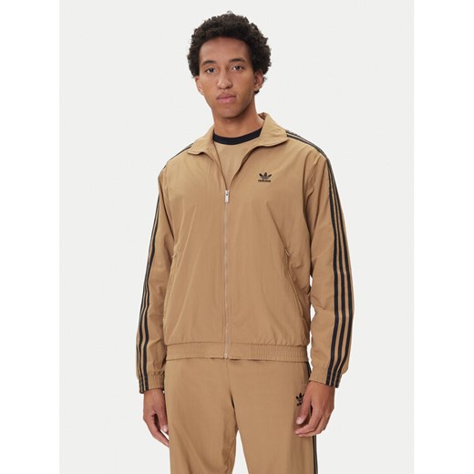 adidas Bluza adicolor Woven Firebird JY1333 Beżowy Loose Fit ze sklepu MODIVO w kategorii Bluzy męskie - zdjęcie 185411913