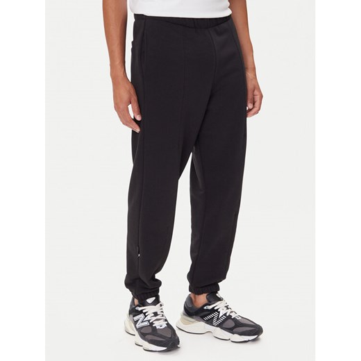 On Spodnie dresowe Club Pants 1ME1004 Czarny Relaxed Fit ze sklepu MODIVO w kategorii Spodnie męskie - zdjęcie 185415984