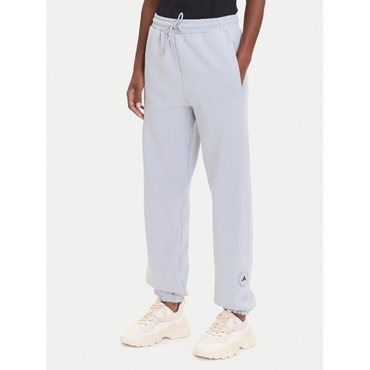adidas by Stella McCartney Spodnie dresowe JX6777 Szary Loose Fit ze sklepu MODIVO w kategorii Spodnie damskie - zdjęcie 185416044