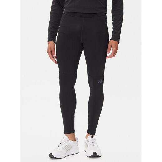 adidas Legginsy Own The Run Winterized JN9597 Czarny Slim Fit ze sklepu MODIVO w kategorii Spodnie męskie - zdjęcie 185416053