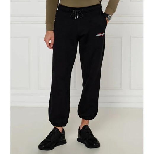 Guess Jeans Spodnie dresowe | Regular Fit ze sklepu Gomez Fashion Store w kategorii Spodnie męskie - zdjęcie 185418434
