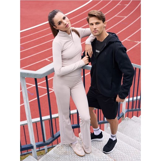 Sinsay - Spodnie flare Gym Hard - kremowy ze sklepu Sinsay w kategorii Spodnie damskie - zdjęcie 185479310