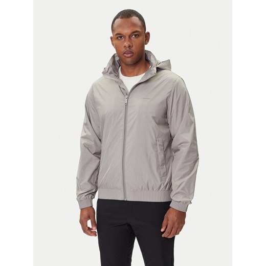 Calvin Klein Kurtka przejściowa LV04LC511G Beżowy Relaxed Fit ze sklepu MODIVO w kategorii Kurtki męskie - zdjęcie 185550772
