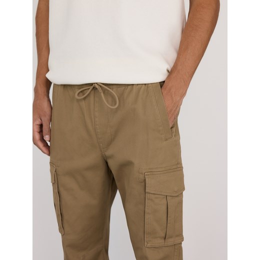 Reserved - Spodnie cargo jogger - beżowy Reserved S Reserved