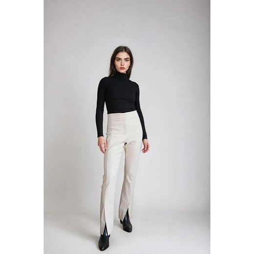 Monki Spodnie w kolorze kremowym ze sklepu Limango Polska w kategorii Spodnie damskie - zdjęcie 185605284