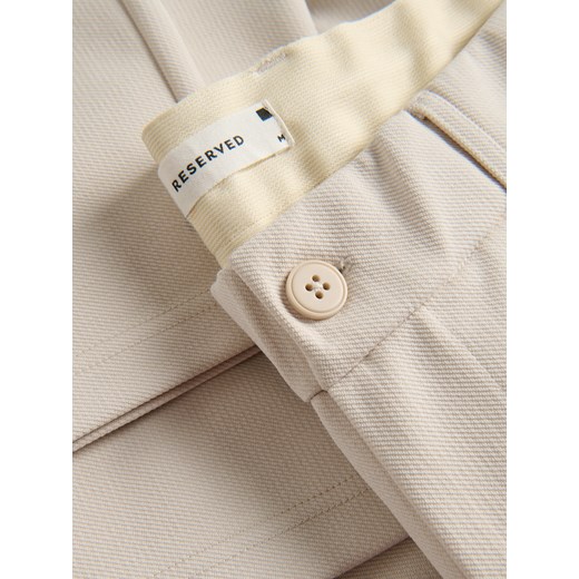 Reserved - Spodnie chino regular fit - beżowy Reserved XXL Reserved
