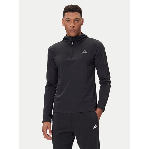 adidas Bluza techniczna Own The Run Winterized JN6378 Czarny Slim Fit ze sklepu MODIVO w kategorii Bluzy męskie - zdjęcie 185635114