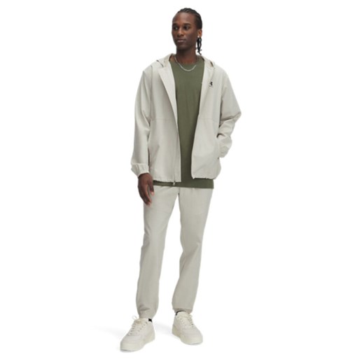 Męskie spodnie treningowe Under Armour UA Vibe Woven Pants -beżowe ze sklepu Sportstylestory.com w kategorii Spodnie męskie - zdjęcie 185650164