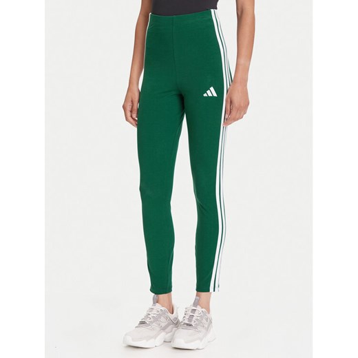 adidas Legginsy Essentials 3-Stripes KB7663 Zielony Slim Fit ze sklepu MODIVO w kategorii Spodnie damskie - zdjęcie 185713694