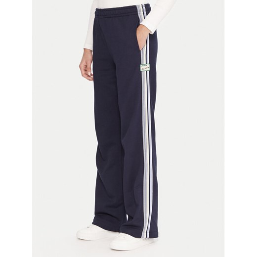 Lacoste Spodnie dresowe XF5250 Granatowy Regular Fit ze sklepu MODIVO w kategorii Spodnie damskie - zdjęcie 185720053