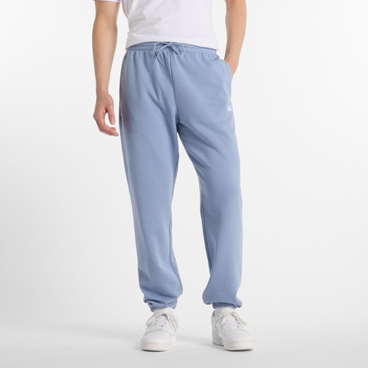 Spodnie męskie New Balance MP41519DUS – niebieskie ze sklepu New Balance Poland w kategorii Spodnie męskie - zdjęcie 185753514