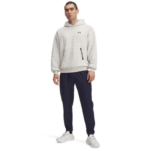 Męskie spodnie treningowe Under Armour UA Unstoppable Tapered Pants - granatowe ze sklepu Sportstylestory.com w kategorii Spodnie męskie - zdjęcie 185755724