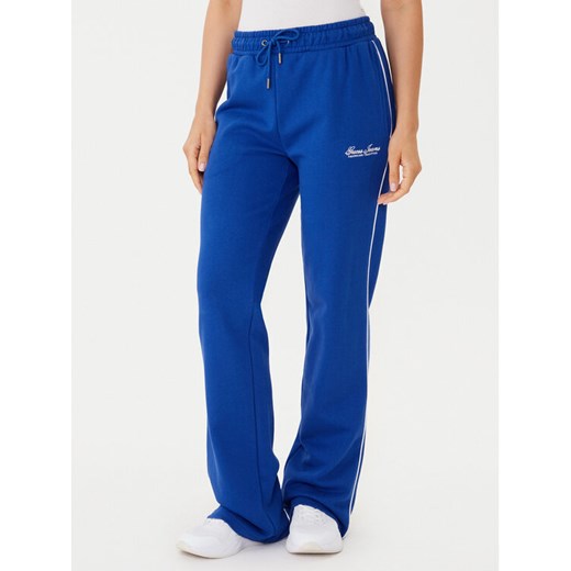 Guess Jeans Spodnie dresowe W5YB32 K68I4 Niebieski Regular Fit ze sklepu MODIVO w kategorii Spodnie damskie - zdjęcie 185783462
