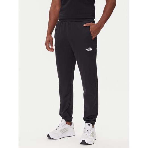 The North Face Spodnie dresowe Reaxion 2.0 NF0A8DRS Czarny Regular Fit ze sklepu MODIVO w kategorii Spodnie męskie - zdjęcie 185820522